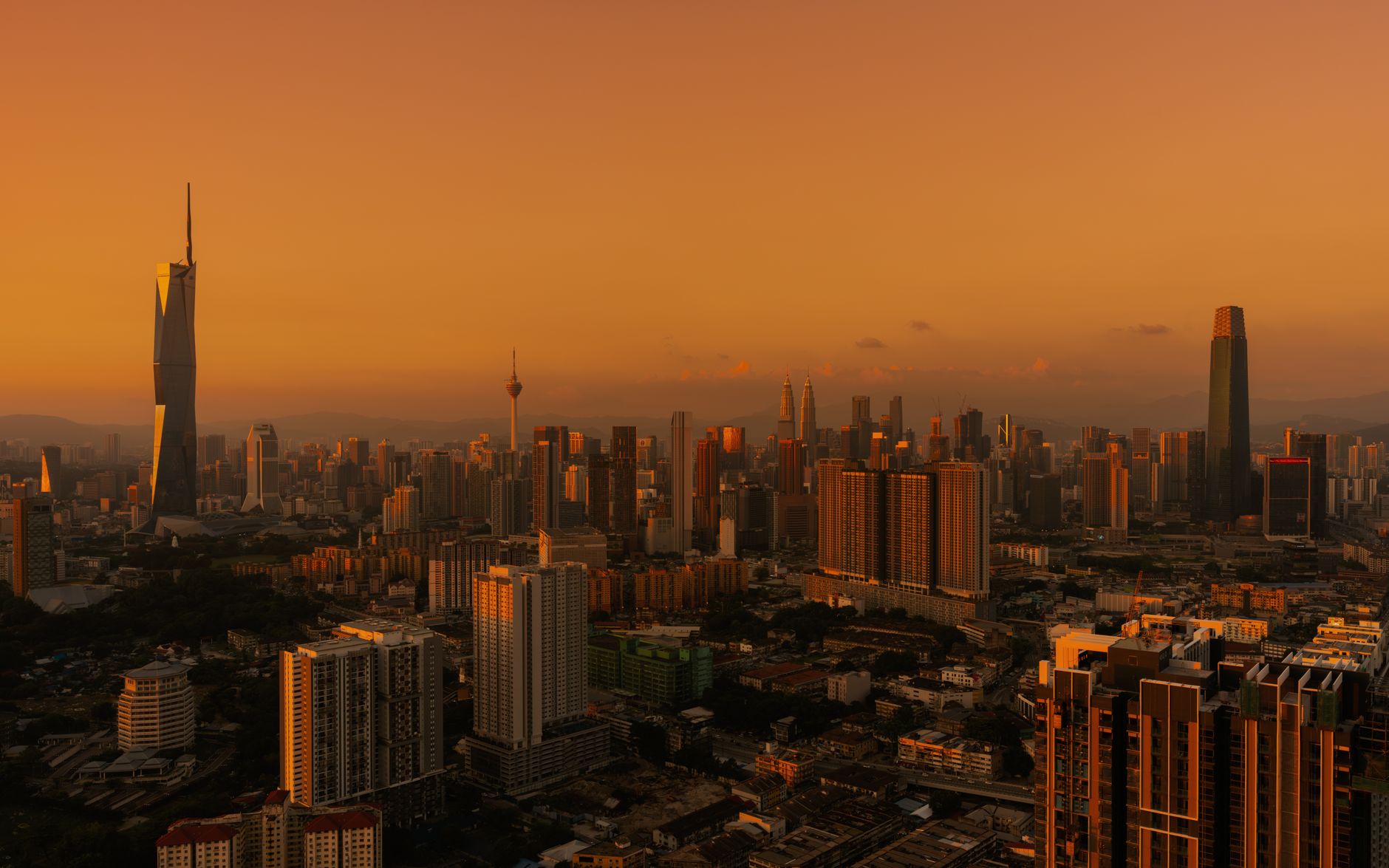 The Kuala Lumpur skyline at golden hour, seen across Petaling Jaya